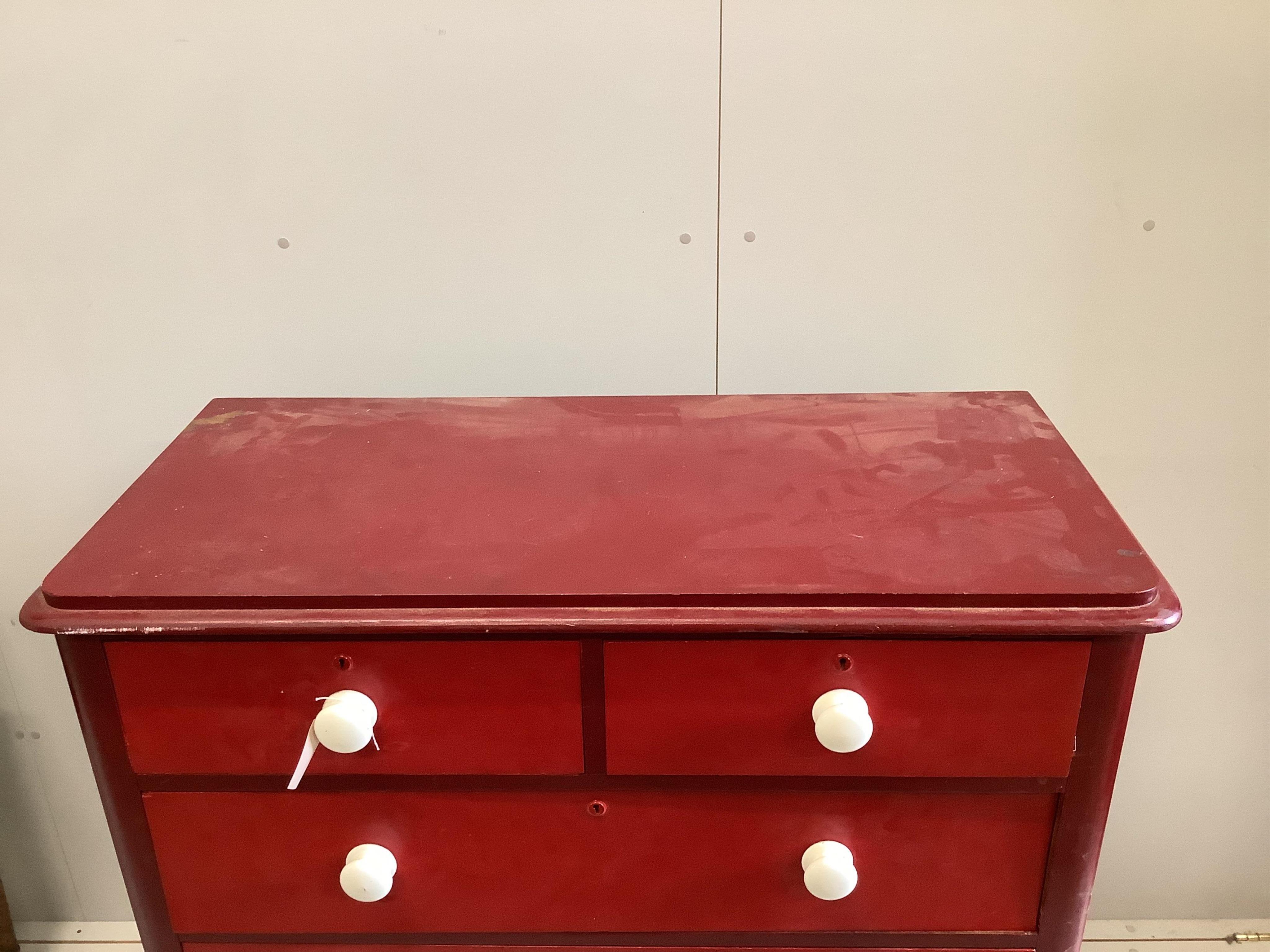 A Victorian pine chest, later painted red, width 114cm, depth 52cm, height 115cm. Condition - fair